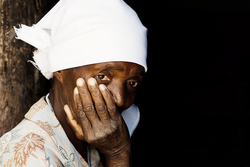 An African widow's despair is seen in her eyes.